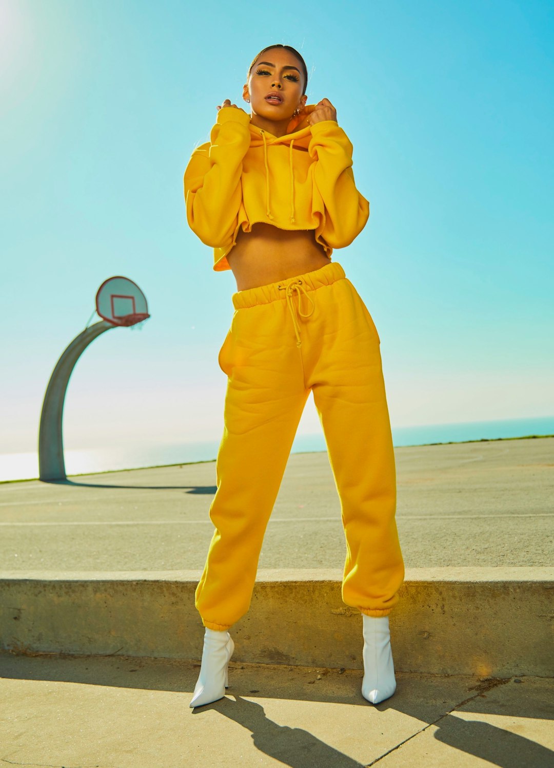 Photo shoot with Montana Yao at the Korean Friendship Bell for Girls Tour by Best 3D Printer woman in yellow tracksuit standing on basketball court side
