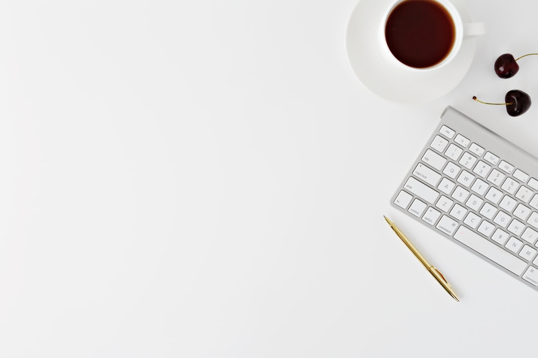 Cherry on desk by Best 3D Printer Magic Keyboard beside mug and click pen