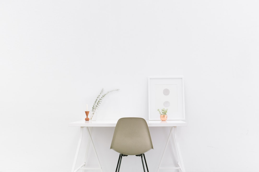 Minimalist white table by Best 3D Printer white wooden table near brown chair